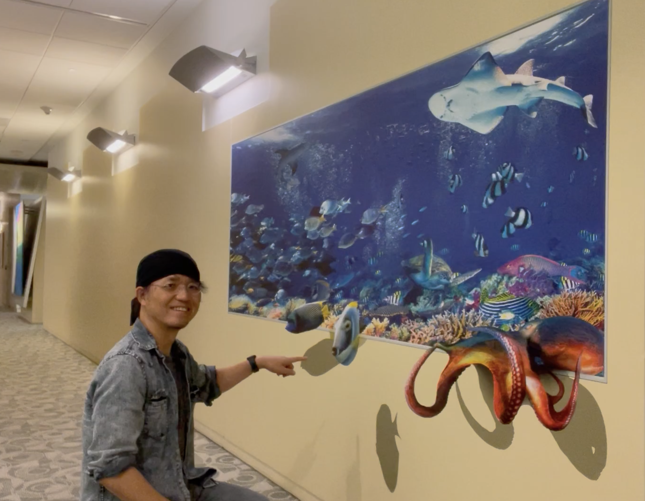 Interacting with a flat aquarium mural that appears three-dimensional